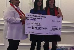3 women accepting a cheque for $10,000 on behalf of the Peel Regional Labour Council